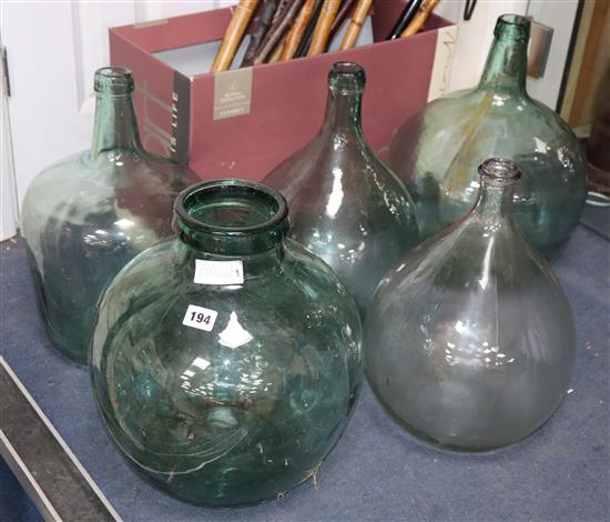 Six green glass carboys